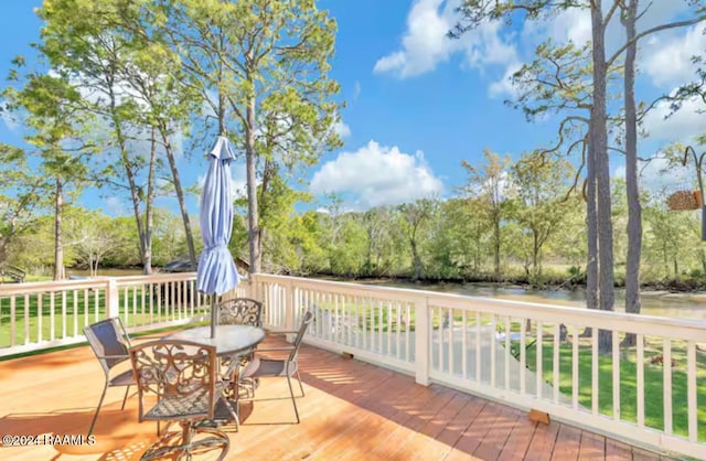 wooden deck with a water view