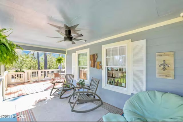 view of patio / terrace with ceiling fan and a porch