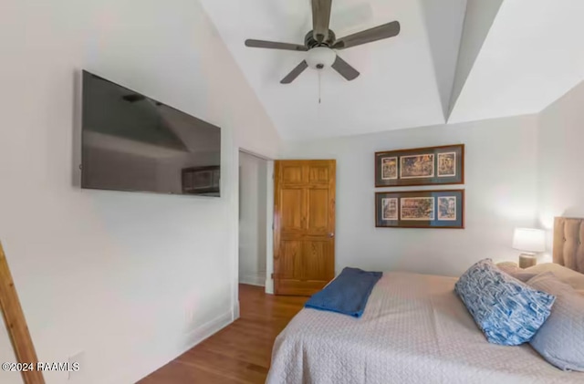 bedroom featuring wood-type flooring, ceiling fan, and lofted ceiling