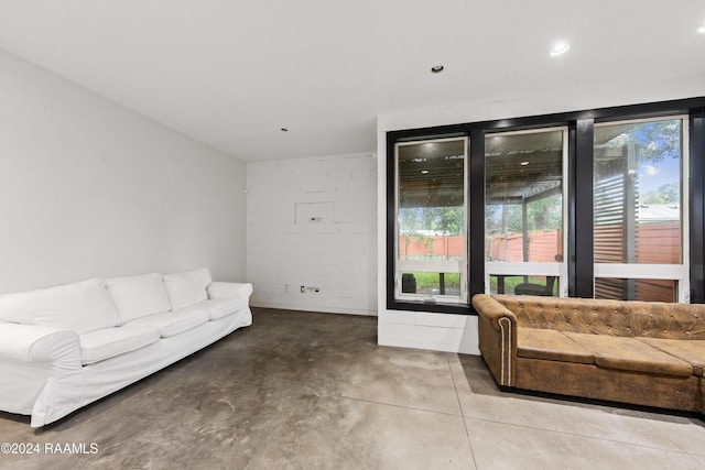 1611 W University Ave, Lafayette, LA 70506 - living area with concrete floors, concrete block wall, and recessed lighting