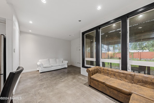 1611 W University Ave, Lafayette, LA 70506 - living room featuring concrete flooring and recessed lighting