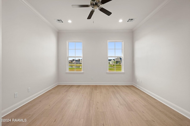 empty room featuring ceiling fan, ornamental molding, and light hardwood / wood-style flooring