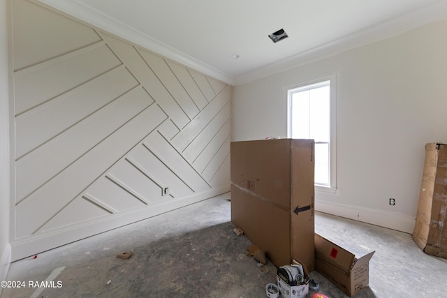 spare room featuring plenty of natural light and ornamental molding