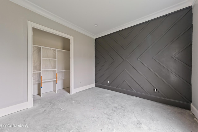 unfurnished bedroom with a closet and crown molding