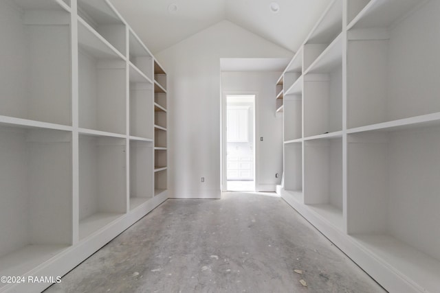 walk in closet with lofted ceiling