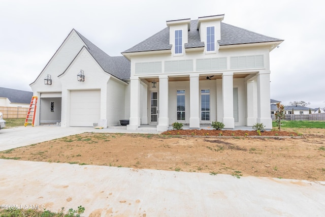 view of front of home featuring a garage and covered porch