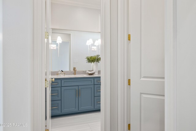 bathroom with vanity and crown molding