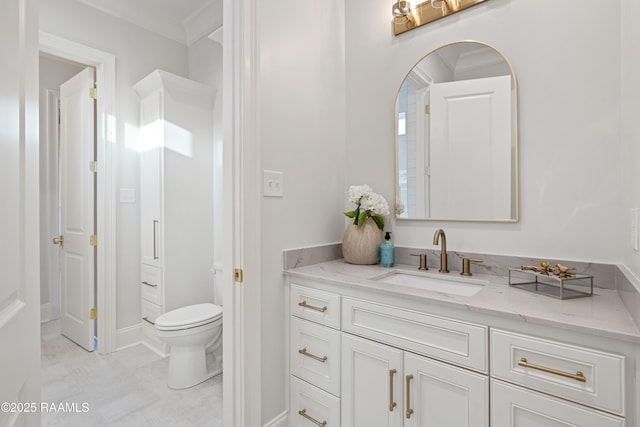 bathroom with toilet and vanity