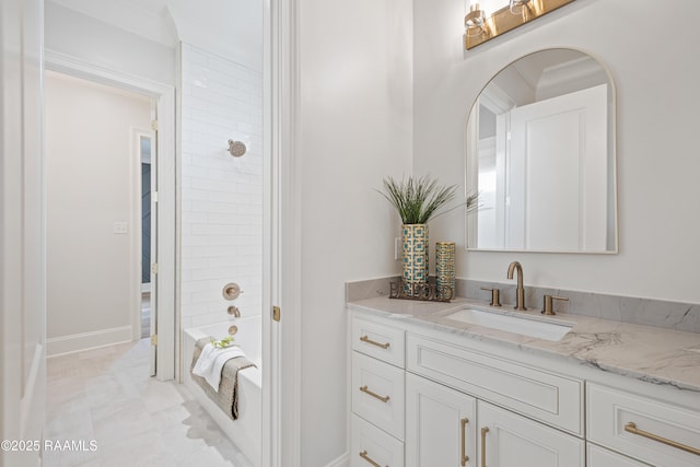 full bathroom with shower / bathing tub combination, baseboards, and vanity