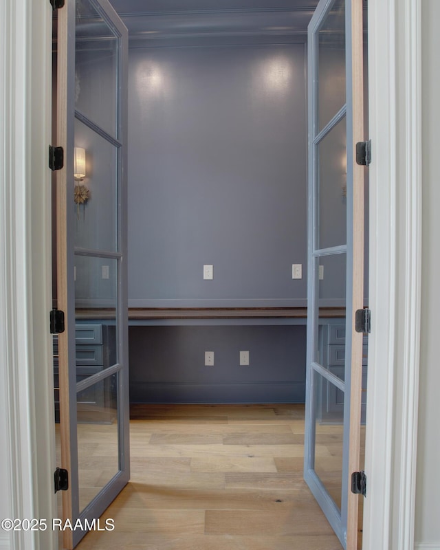 interior space featuring french doors and wood finished floors