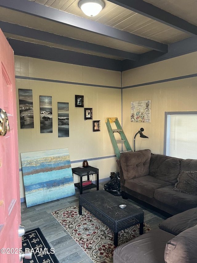 living room with beam ceiling, wooden walls, wood ceiling, and wood-type flooring