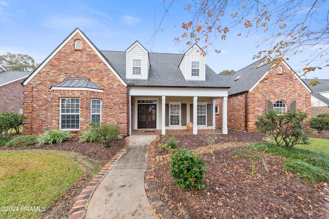 1013 Bayou Bend Cir, Breaux Bridge, LA 70517 - view of front of house featuring brick siding, a porch, and roof with shingles