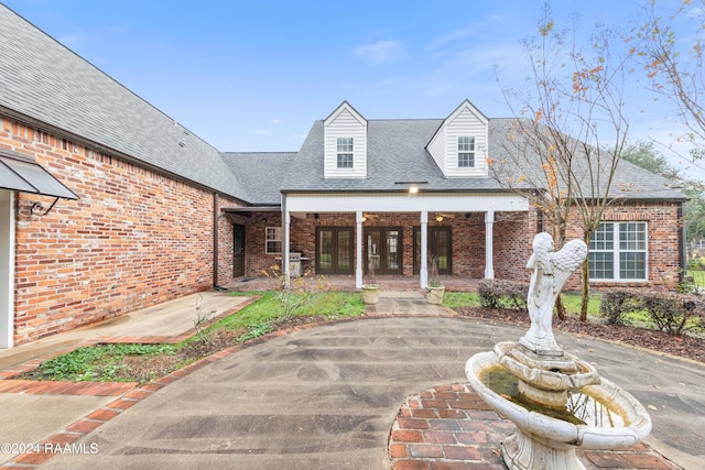 1013 Bayou Bend Cir, Breaux Bridge, LA 70517 - view of patio featuring curved driveway