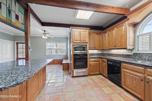 kitchen featuring dark stone counters, black appliances, crown molding, ceiling fan, and kitchen peninsula