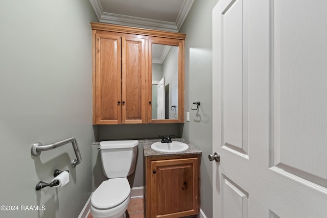 bathroom with vanity, toilet, and crown molding