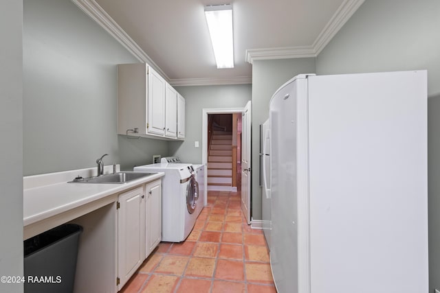 laundry area with cabinets, separate washer and dryer, crown molding, and sink