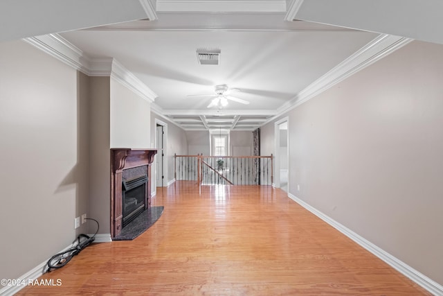 unfurnished living room with ceiling fan, crown molding, and light wood-type flooring