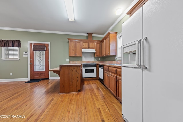 1013 Bayou Bend Cir, Breaux Bridge, LA 70517 - kitchen featuring white appliances, under cabinet range hood, crown molding, light countertops, and a kitchen island