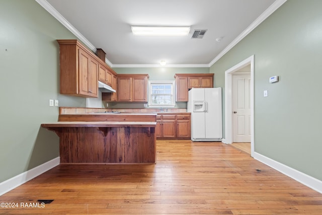 kitchen with white refrigerator with ice dispenser, sink, crown molding, light hardwood / wood-style flooring, and cooktop
