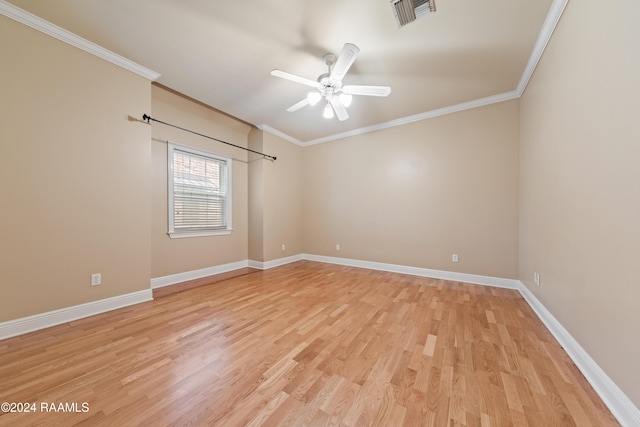 spare room with ceiling fan, light wood-type flooring, and crown molding