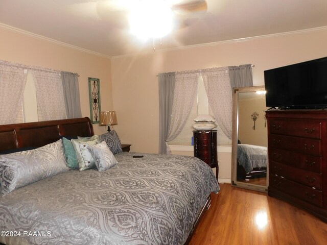 2001 Segura Rd, New Iberia, LA 70560 - bedroom featuring crown molding and hardwood / wood-style flooring
