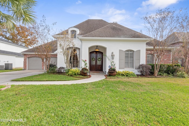 view of front facade featuring french doors, a front lawn, and cooling unit