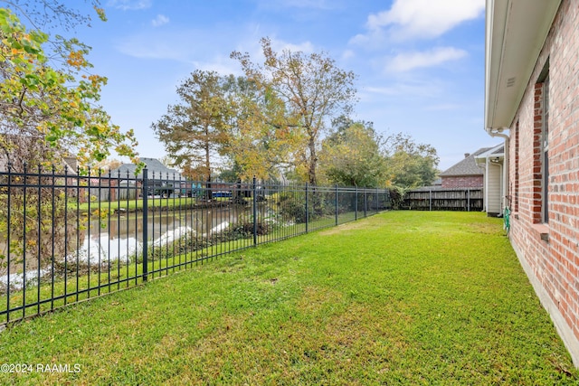 view of yard with a water view