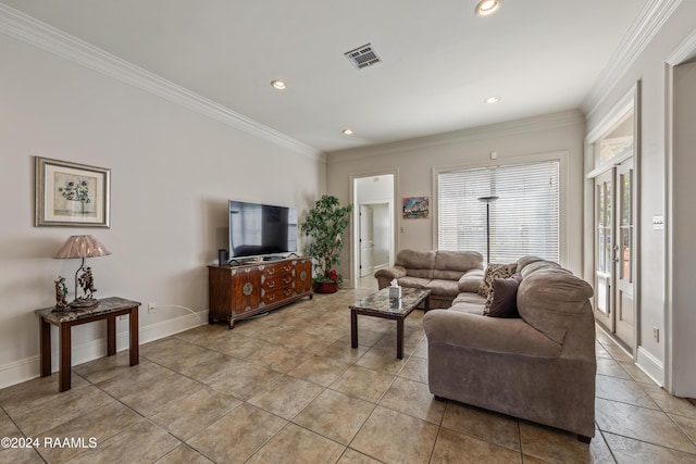 living room with light tile patterned floors and crown molding