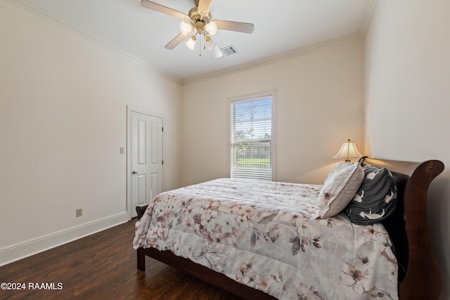 bedroom featuring ceiling fan, dark hardwood / wood-style flooring, and ornamental molding