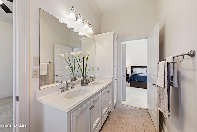 bathroom with tile patterned floors, vanity, and crown molding