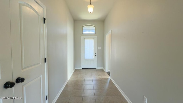 doorway to outside featuring light tile patterned floors