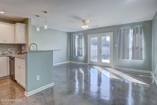 kitchen featuring white cabinetry, french doors, ceiling fan, and decorative light fixtures