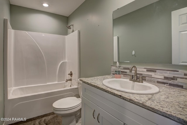 full bathroom featuring decorative backsplash, toilet, shower / bath combination, and vanity