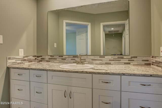 bathroom with backsplash and vanity