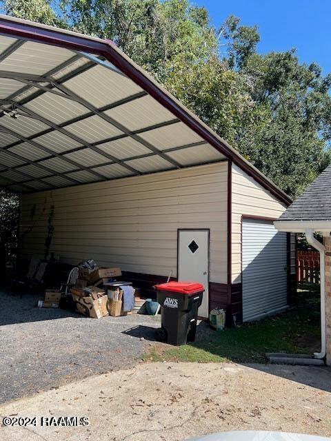 view of vehicle parking featuring a carport