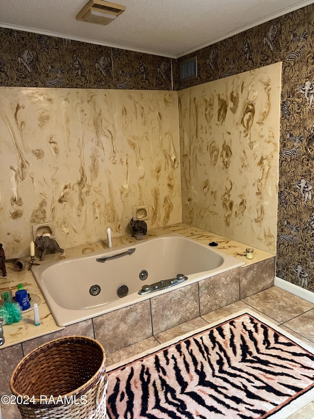 bathroom with tile patterned floors, a textured ceiling, and tiled bath