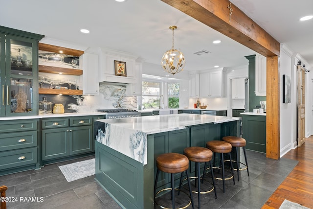 kitchen with pendant lighting, white cabinets, green cabinets, beamed ceiling, and dark hardwood / wood-style flooring