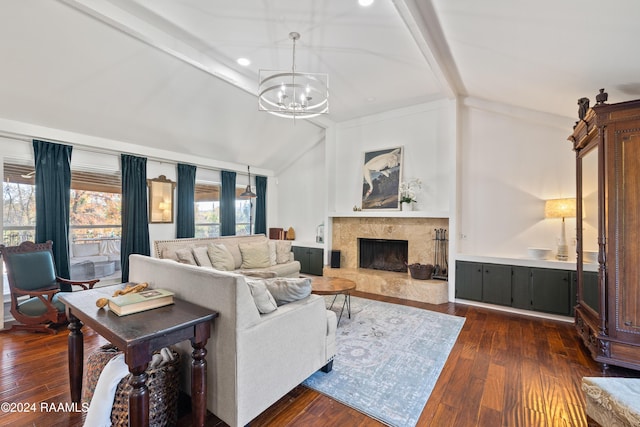 living room featuring a high end fireplace, dark hardwood / wood-style flooring, vaulted ceiling with beams, and an inviting chandelier