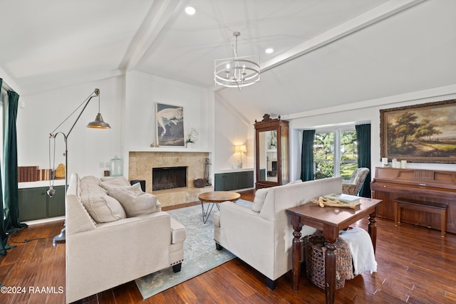 living room featuring vaulted ceiling with beams, dark hardwood / wood-style flooring, a high end fireplace, and an inviting chandelier