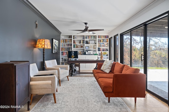 living room with ceiling fan and crown molding