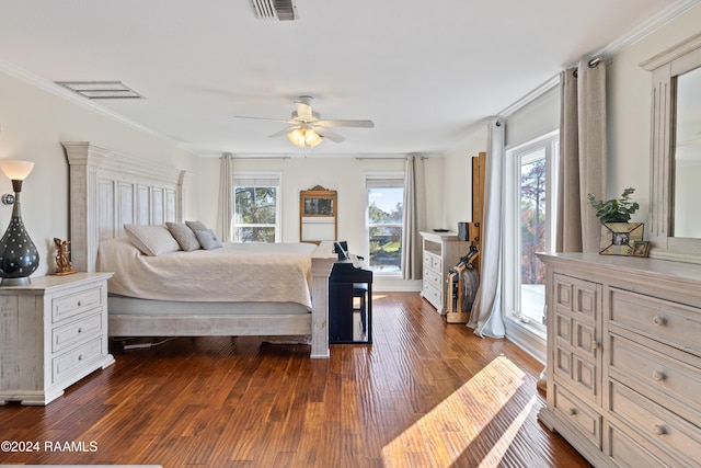 bedroom featuring ceiling fan, crown molding, dark wood-type flooring, and multiple windows