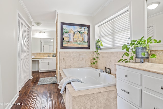 bathroom with hardwood / wood-style floors, vanity, and ornamental molding