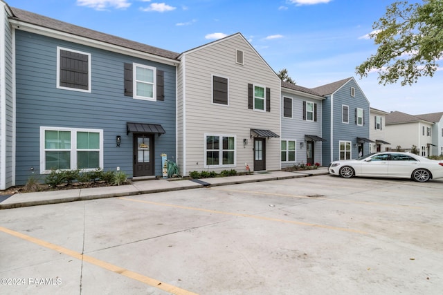 104 Whittington Dr Unit M, Lafayette, LA 70503 - townhome / multi-family property with uncovered parking and a residential view