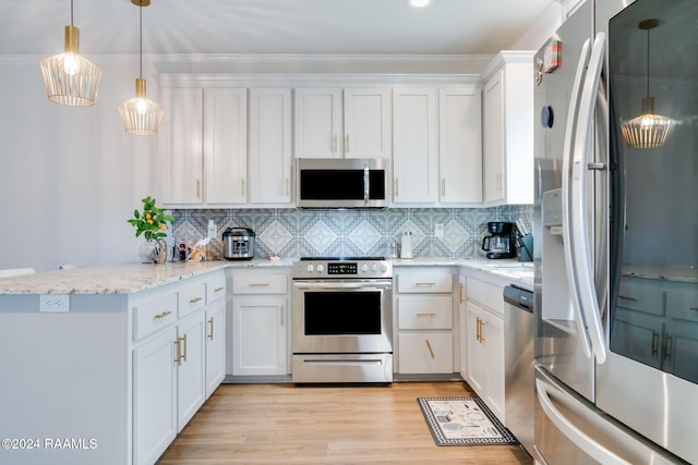 kitchen featuring kitchen peninsula, decorative backsplash, white cabinets, and stainless steel appliances