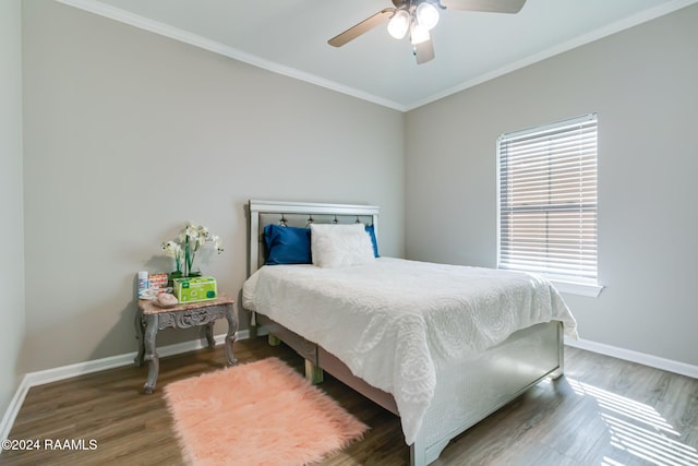 bedroom with ceiling fan, dark hardwood / wood-style flooring, and crown molding