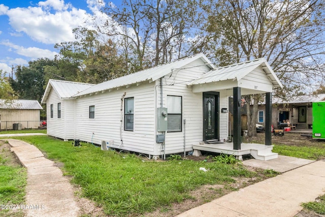 807 American Legion Dr, Rayne, LA 70578 - view of property exterior with a metal roof and a yard