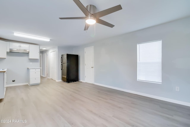 unfurnished living room featuring light hardwood / wood-style floors and ceiling fan