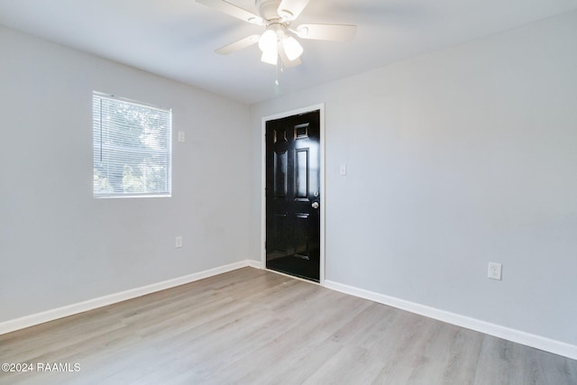 spare room with ceiling fan and light hardwood / wood-style floors