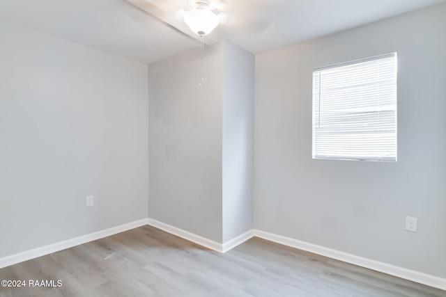 unfurnished room with light hardwood / wood-style flooring