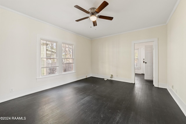 empty room with ceiling fan, dark hardwood / wood-style flooring, and ornamental molding